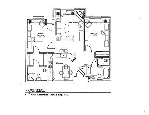 A floor plan of a home with a living room, dining room, kitchen, and two bedrooms.